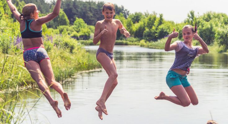 2 men running on water during daytime